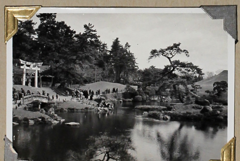 Visitors stroll on a path in a Japanese garden (ddr-densho-404-283)