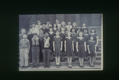 (Slide) - Image of group of boys and girls standing on steps of building (Maryknoll school) (ddr-densho-330-229-master-f700bbcfbf)