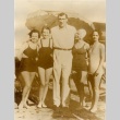 Primo Carnera posing with girls on a beach (ddr-njpa-1-100)
