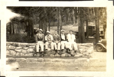 Five men sitting on stone wall (ddr-densho-326-479)