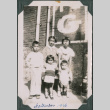 Five children next to brick building (ddr-densho-483-651)