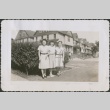 Three women in front of houses (ddr-densho-298-202)