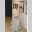 Sun Ock Lee at an art show with sumi-e paintings (ddr-densho-377-315)