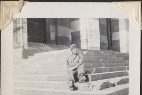 Man sitting on steps (ddr-densho-466-716)