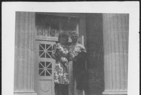 Woman and man standing on steps (ddr-densho-434-493)