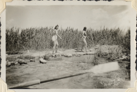Two women in bathing suits on riverside (ddr-densho-466-652)