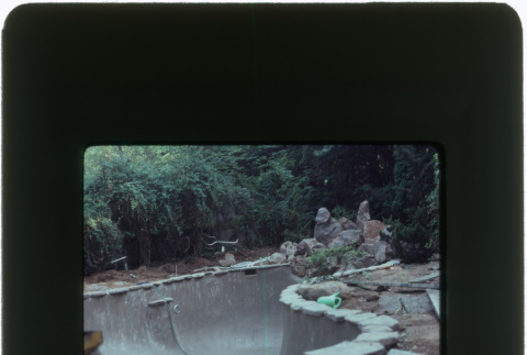 Construction on a pool and rock garden (ddr-densho-377-1140)