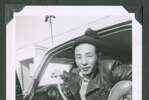 Man sitting in car (ddr-densho-471-123)