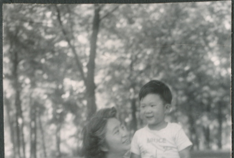 Agnes Sakura and boy sitting on lawn (ddr-densho-523-217)