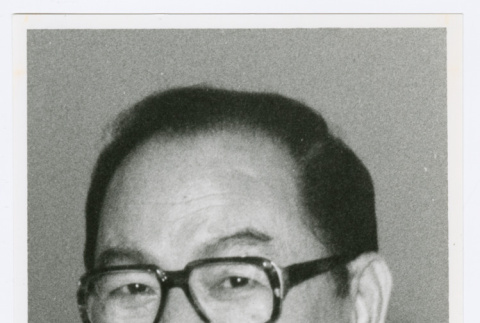 Portrait of person with glasses and lei (ddr-densho-1007-74)