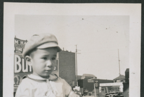 Photo of a child holding a bag (ddr-densho-483-719)