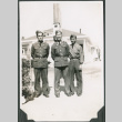 Three men standing in front of building.  Joe Iwataki in center (ddr-ajah-2-129)