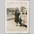A woman standing next to a car (ddr-densho-316-33)