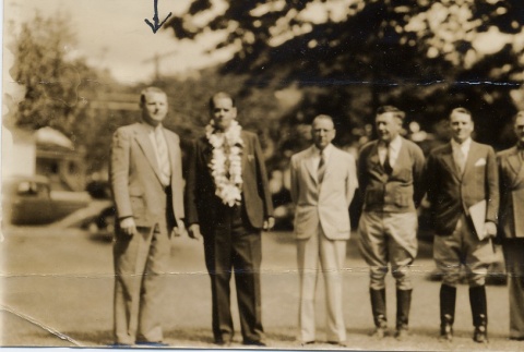 Group of men in suits posing for a photograph (ddr-njpa-2-575)