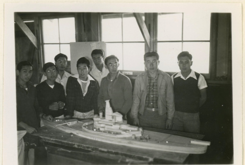 Battleship model and working crew (ddr-densho-37-1351)