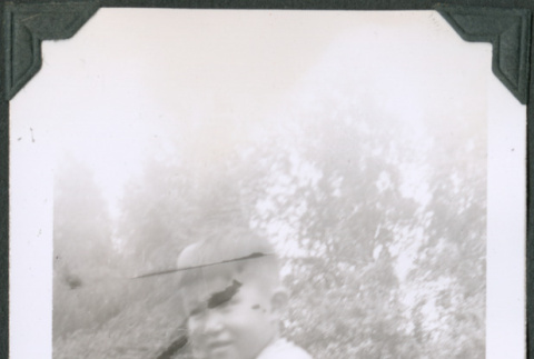 Photo of a boy holding a baseball glove (ddr-densho-483-1175)