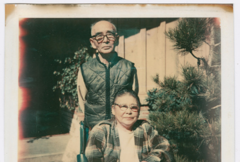 Man standing and woman in wheelchair (ddr-densho-501-43)