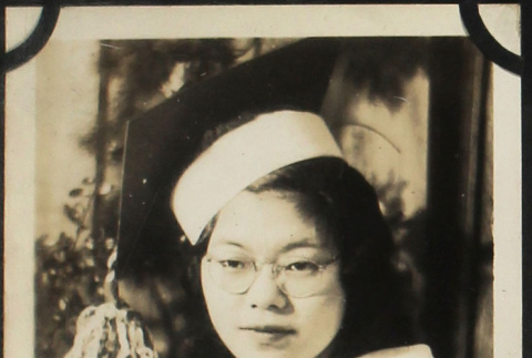 Tomoye (Nozawa) Takahashi wearing graduation mortar board (ddr-densho-423-503)