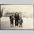 Chester Sakura with two boys on ice skates (ddr-densho-523-171)