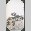 Men sitting on hillside with rifles (ddr-ajah-2-197)