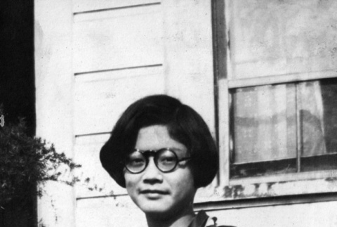 Marge Kajiwara standing outside house (ddr-ajah-6-71)