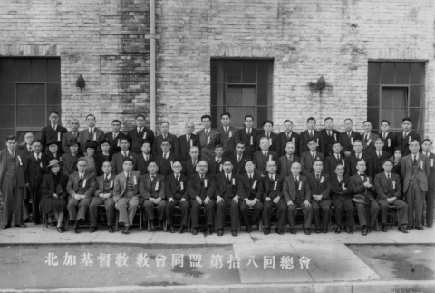 Large group posing outside building (ddr-ajah-6-394)