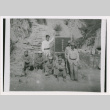 Eight servicepeople with sign (ddr-densho-1007-183)