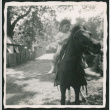 Miki Domoto riding a pony at the Bronx Zoo (ddr-densho-443-156)
