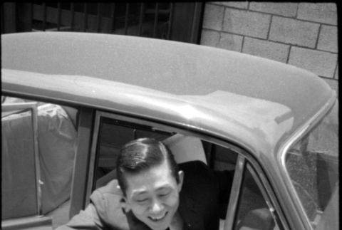 Man in drivers seat of car (ddr-densho-426-2288)