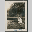 woman sitting under tree (ddr-densho-378-741)