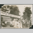 Group of people under banner for Seattle Japanese Grocers Assn Picnic (ddr-densho-483-547)