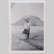 Couple standing on boardwalk with hill in background (ddr-densho-464-102)