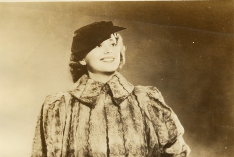 Woman posing in a fur coat (ddr-njpa-1-1550)