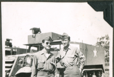 Two soldiers standing near a truck (ddr-densho-201-524)