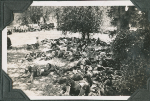 Group of men lying in shade (ddr-ajah-2-191)