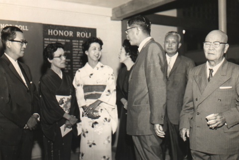 Nobusuke Kishi's family being welcomed by Japanese Chamber of Commerce members (ddr-njpa-4-424)