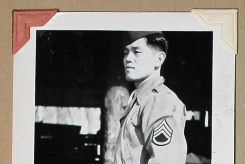 Man in military uniform holding a cigarette (ddr-densho-404-400)