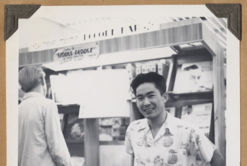 Gary Kikawa by a music display (ddr-densho-542-98)