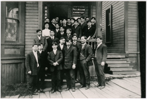 A group on the steps of the Japanese Presbyterian mission and dormitory (ddr-densho-353-293)
