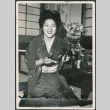 Woman in kimono with flowers (ddr-densho-316-358)