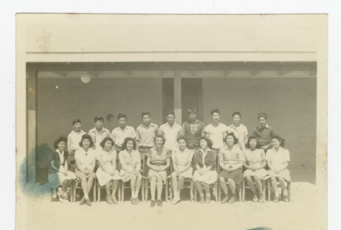 Large group of Nisei students with a teacher in front of barrack (ddr-csujad-44-41)
