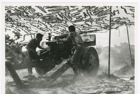Cpl. Edward Nakamura and Pfc. George Tanna firing 105mm Howitzer in the Battle for Leghorn (ddr-densho-1007-163)