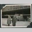 Two men stand in front of glider (ddr-densho-397-201)