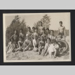 Photograph of Japanese individuals sitting on the beach (ddr-csujad-55-2633)