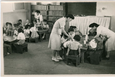 Photo of children seated at tables (ddr-densho-399-17)