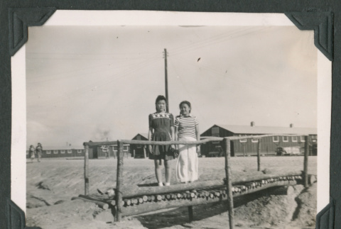 Two women on a bridge in a camp (ddr-densho-471-20)