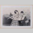 Mary Alice and David practicing wind instruments (ddr-densho-462-269)