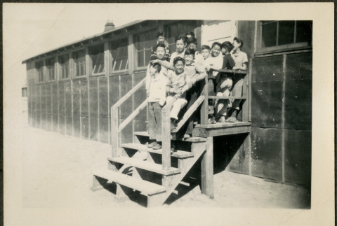 Group of male children on barrack stairs (ddr-csujad-32-19)