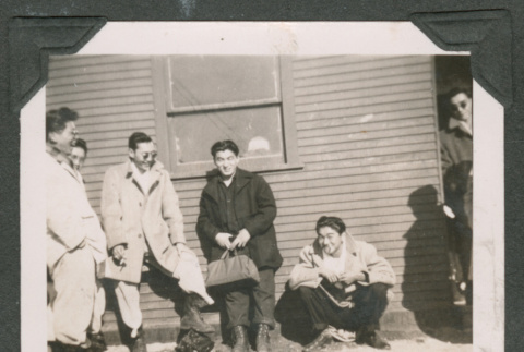 Young men waiting for the bus (ddr-densho-463-128)
