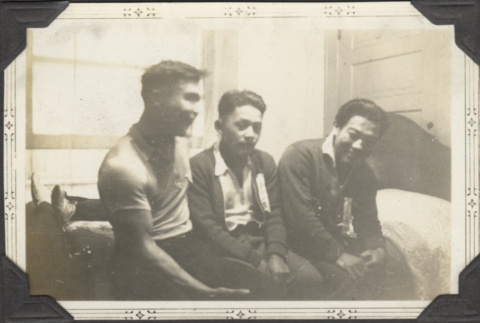 Three men sitting on a bed (ddr-densho-326-501)